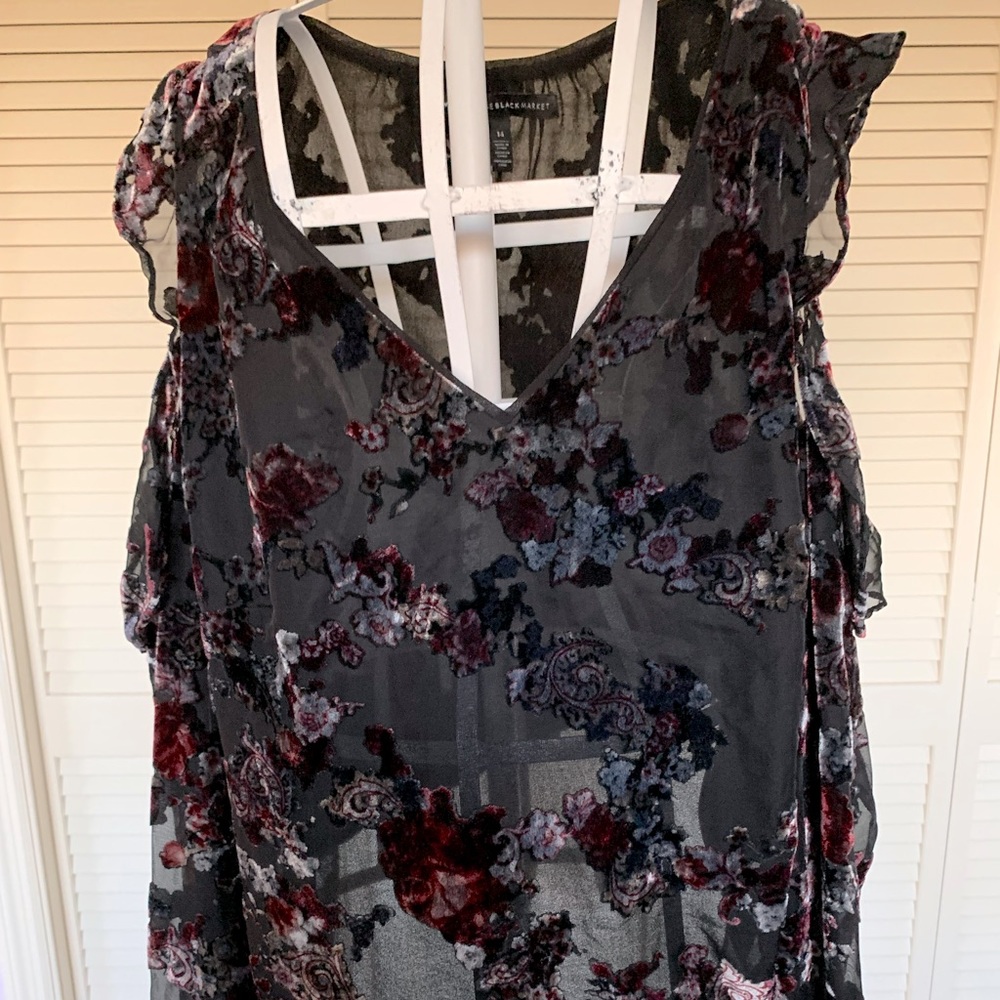 A beautiful black blouse with Rich velveteen flowers